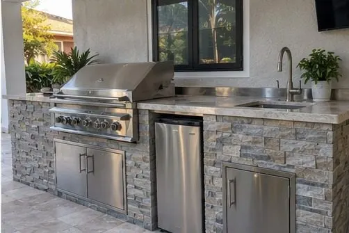 Finished stainless outdoor kitchen on a covered patio